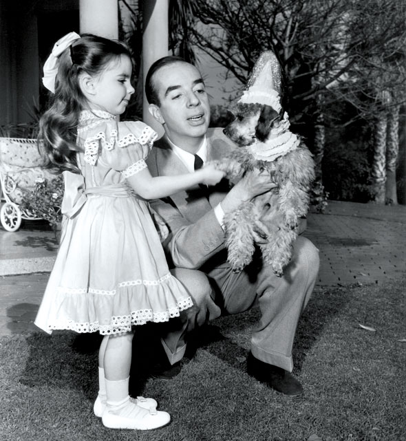 Vincent and Liza Minnelli Pictured on her fourth birthday, Liza Minnelli looks delighted as she shakes hands with her new pet poodle (MGM, 1950)